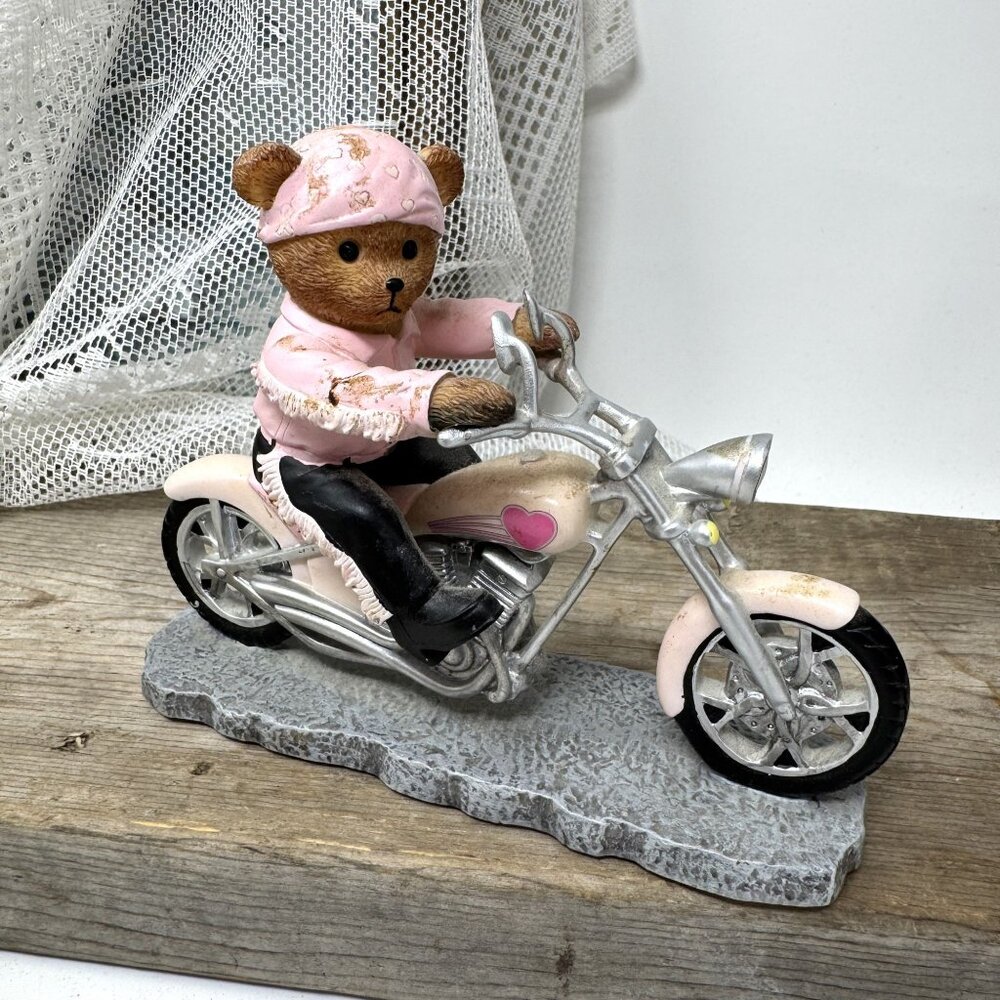 Teddy Bear Figurine On Pink Motorcycle Headed for a Cure